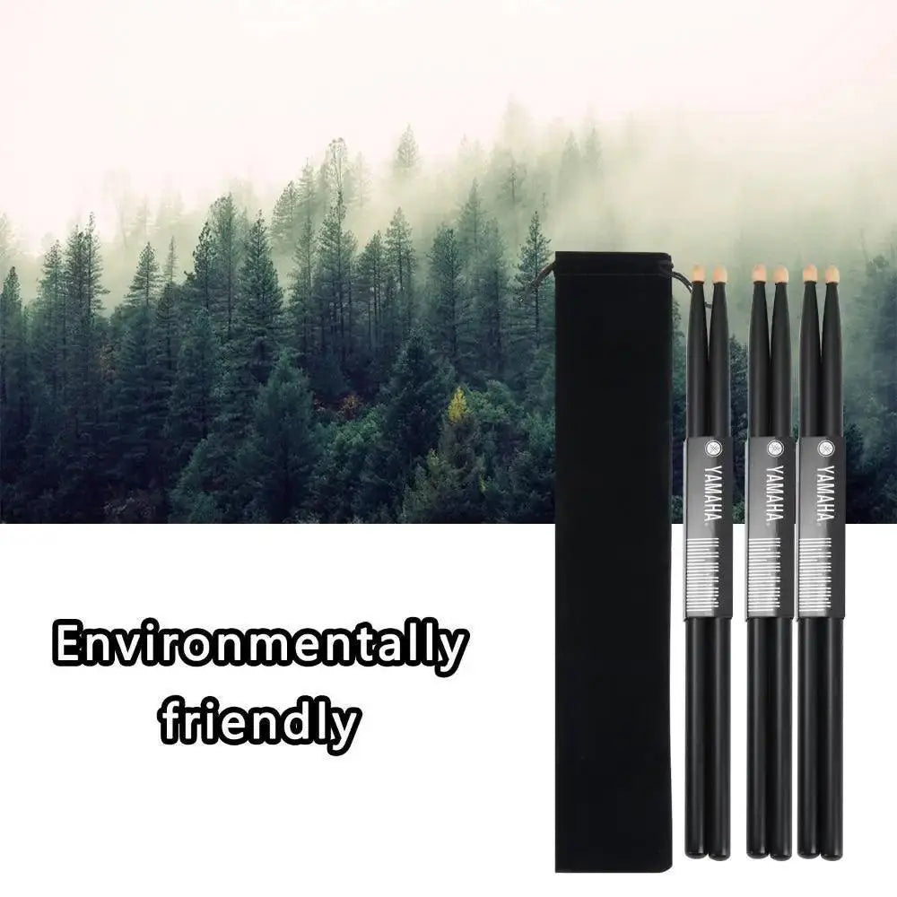 Black 5A wood drumsticks set with carrying bag, eco-friendly, forest background