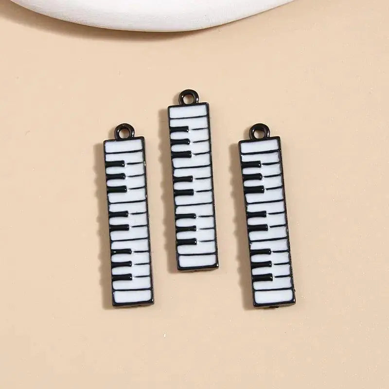 Three enamel keyboard charms for DIY jewelry, music-themed accessories at OurLum.com