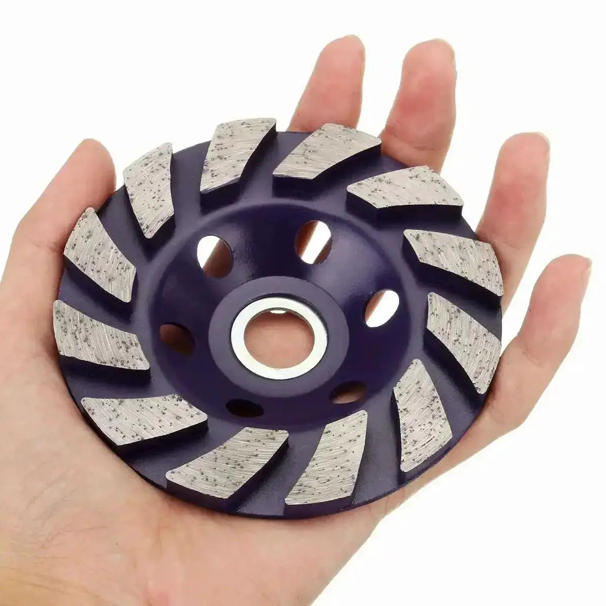 Hand holding a 4-inch diamond grinding wheel disc, bowl-shaped, for tech tools at OurLum.com