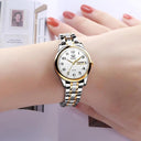 Sleek Women's Gold Quartz Watch with Day-Date Feature Design