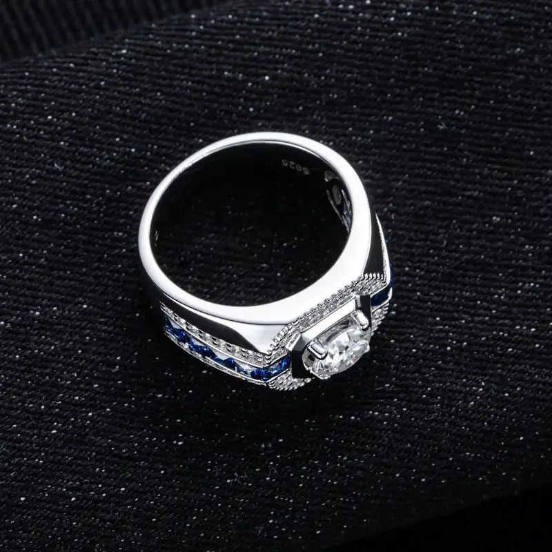 Square-profile statement ring described with a blue moissanite stone