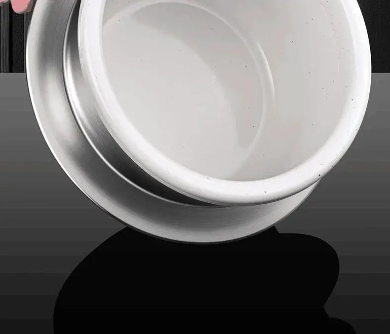Stainless steel and ceramic bowl on dark surface, premium kitchenware from OurLum.com
