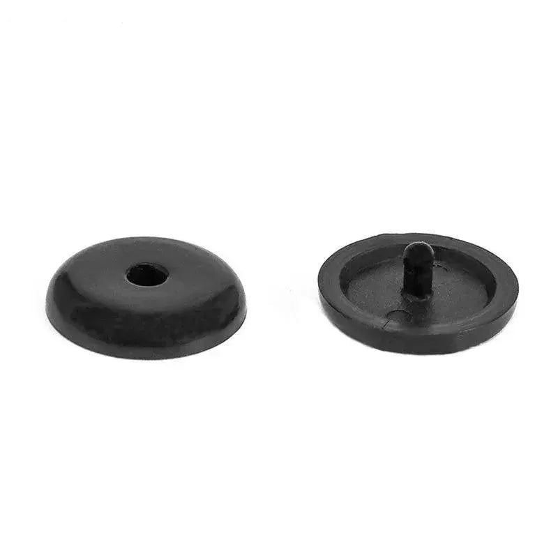 Black plastic replacement button backs on white background, OurLum tech accessory