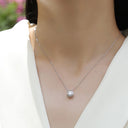 Round Cross Moissanite Pendant Necklace in Sterling Silver