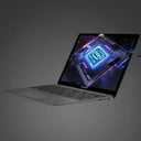 A dark gray Lenovo laptop shown open at an angle on a plain white background, with the screen displaying a glowing Intel processor graphic.