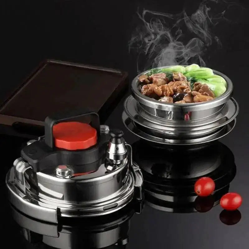 Stainless steel lunch box and steamer with fresh hot food, perfect for healthy meals at OurLum.com.