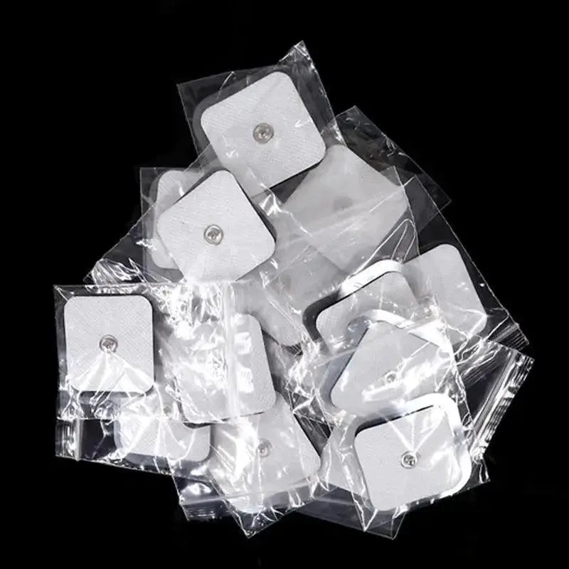 Electrode gel pads for TENS muscle stimulator, individually packed, on black background