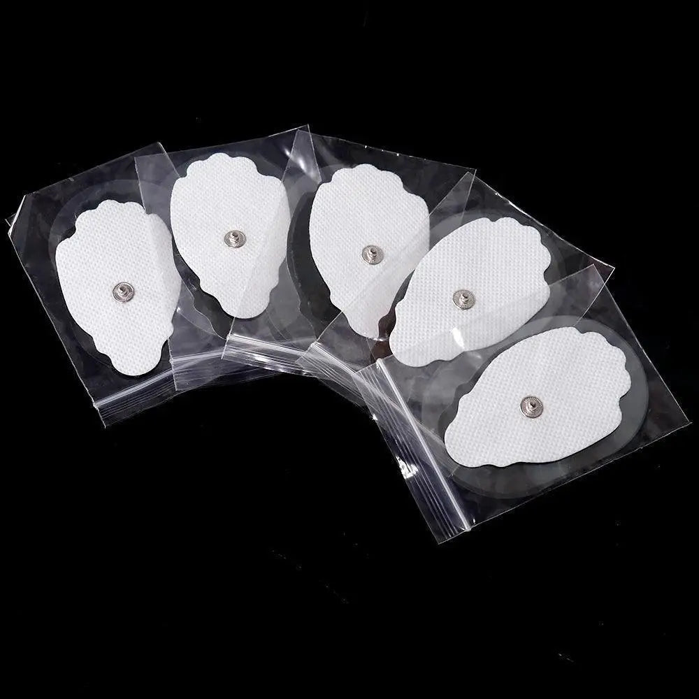 Five white TENS electrode gel pads for physiotherapy and muscle stimulator on black background