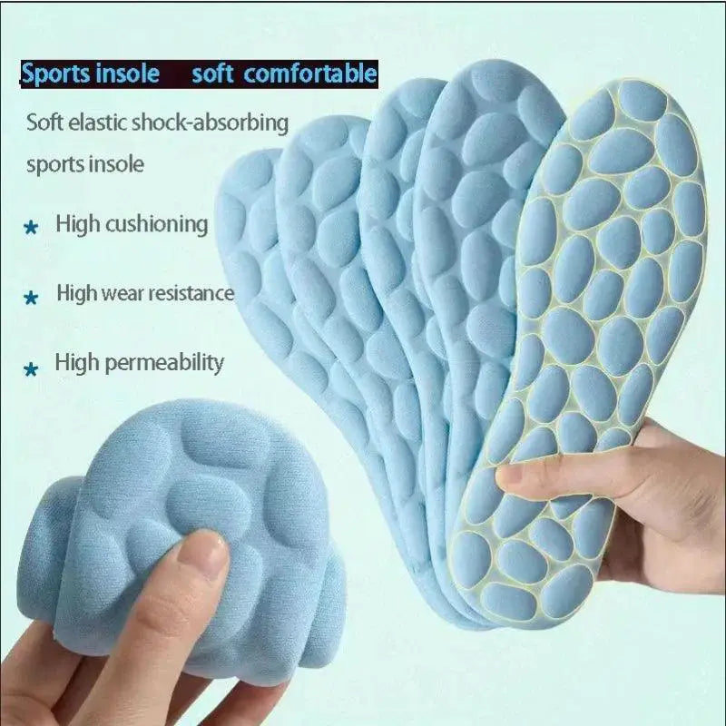 Set of four blue memory foam sports insoles with acupressure support, textured surface.