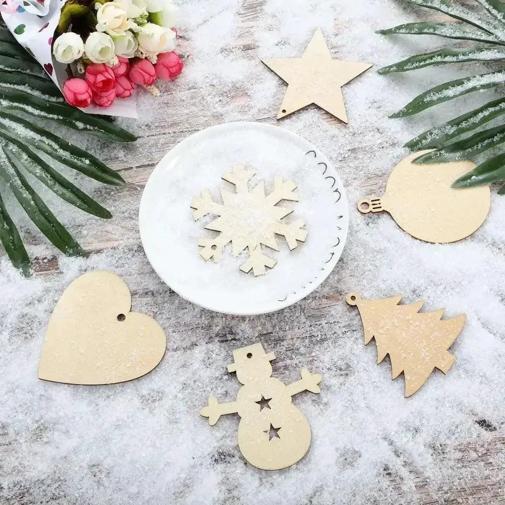 Unfinished wooden Christmas ornaments in various shapes on snowy surface, craft supplies from OurLum.com.