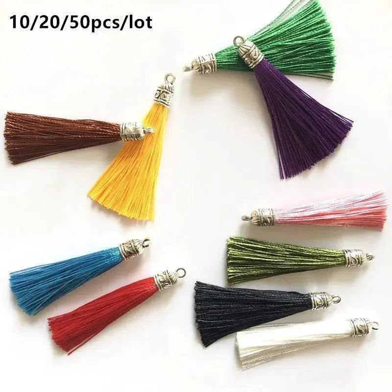 Colorful silk tassel charms with silver caps for DIY jewelry making, displayed on white background