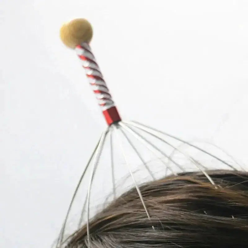 Octopus scalp massager with metal prongs in use on brown hair, relaxation tool
