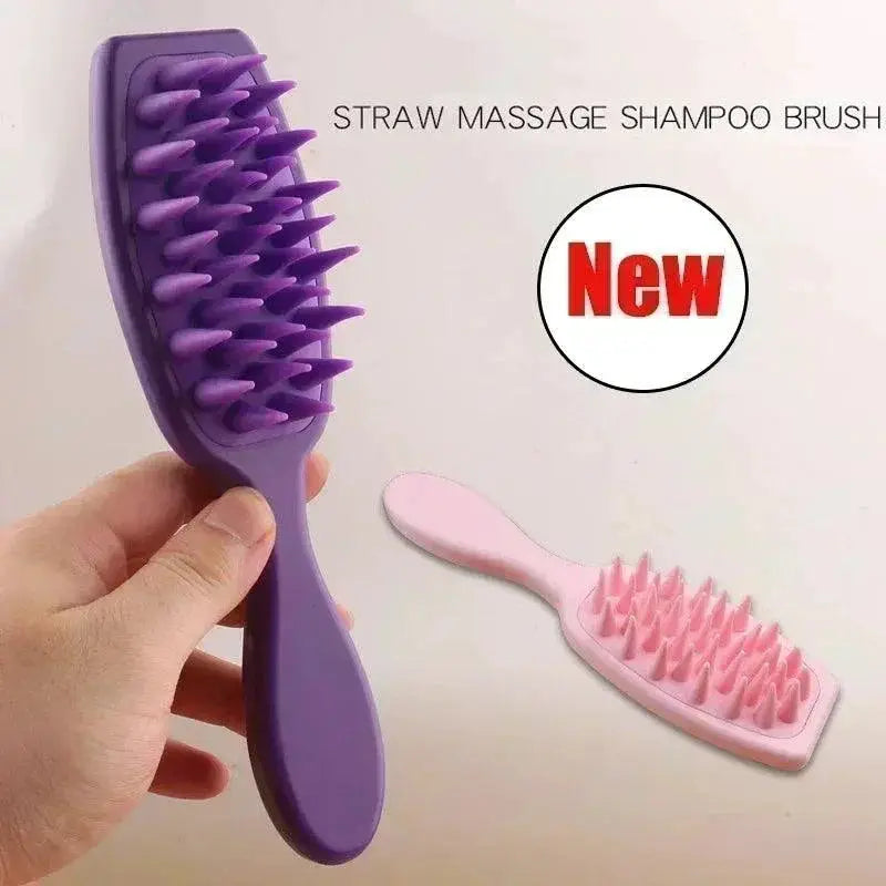 Hand holding a dark pink silicone scalp massaging brush with bristle spikes, next to a light pink shampoo brush on white background.