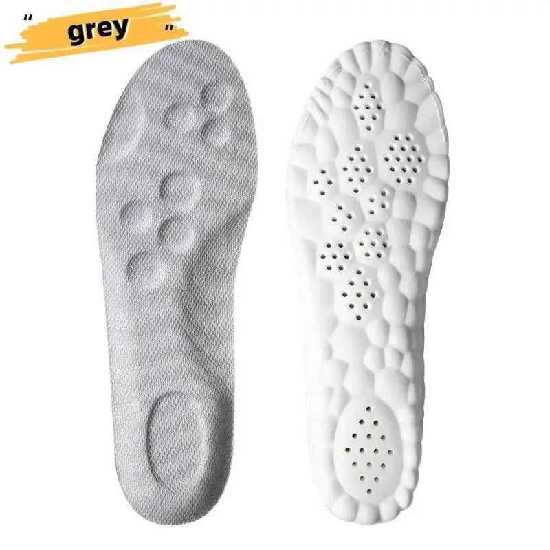 Pair of grey and white sports insoles with textured cushioning and perforated support design.