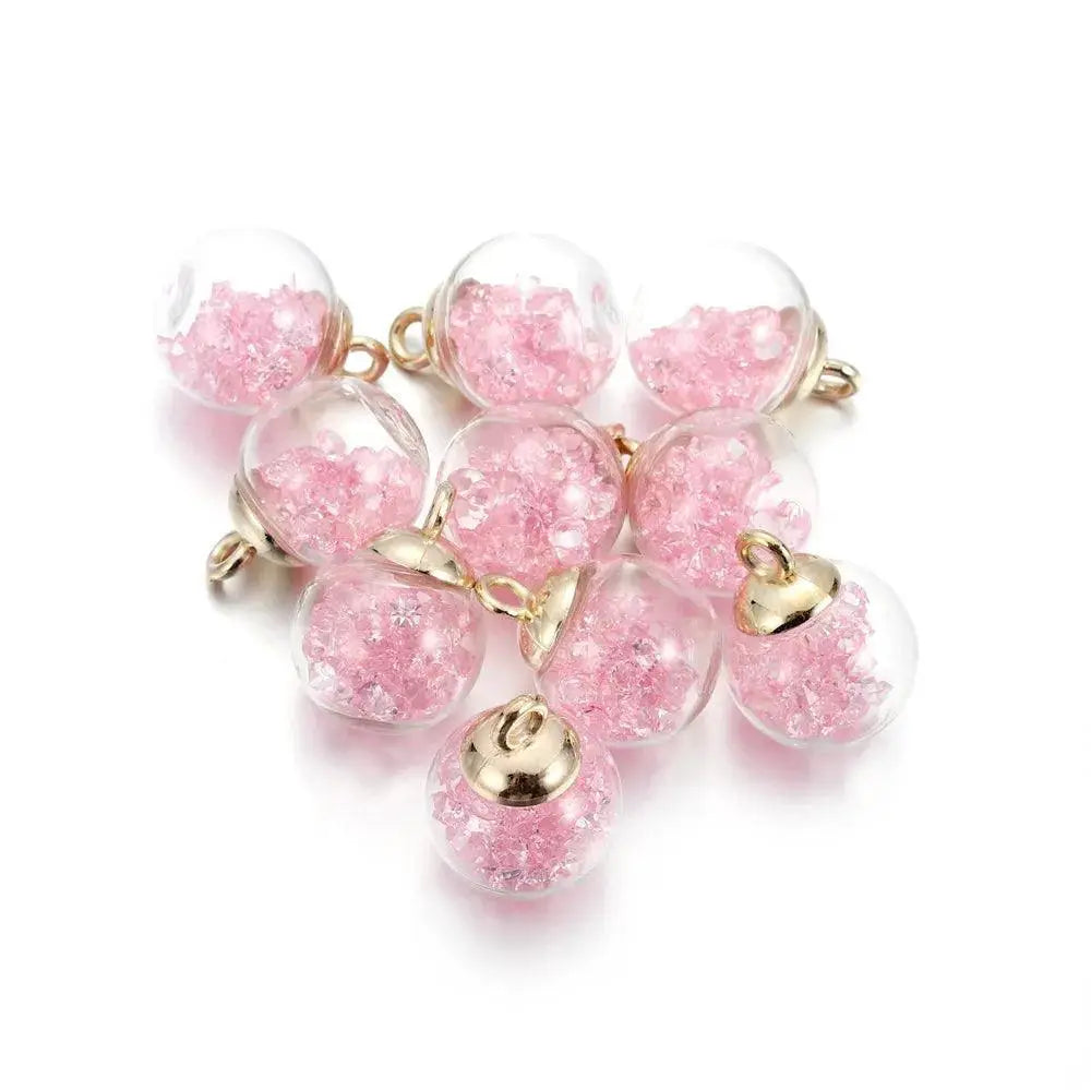 Set of clear glass ball pendants with pink star sequins and gold caps for DIY jewelry