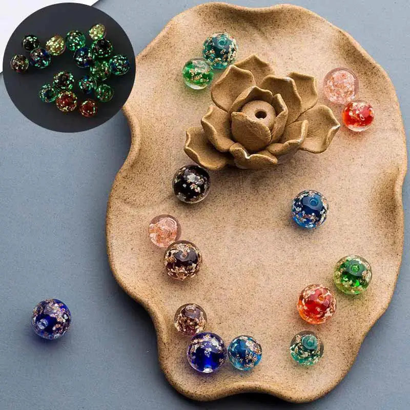 Handmade luminous lampwork glass beads for DIY jewelry on decorative plate, OurLum.com