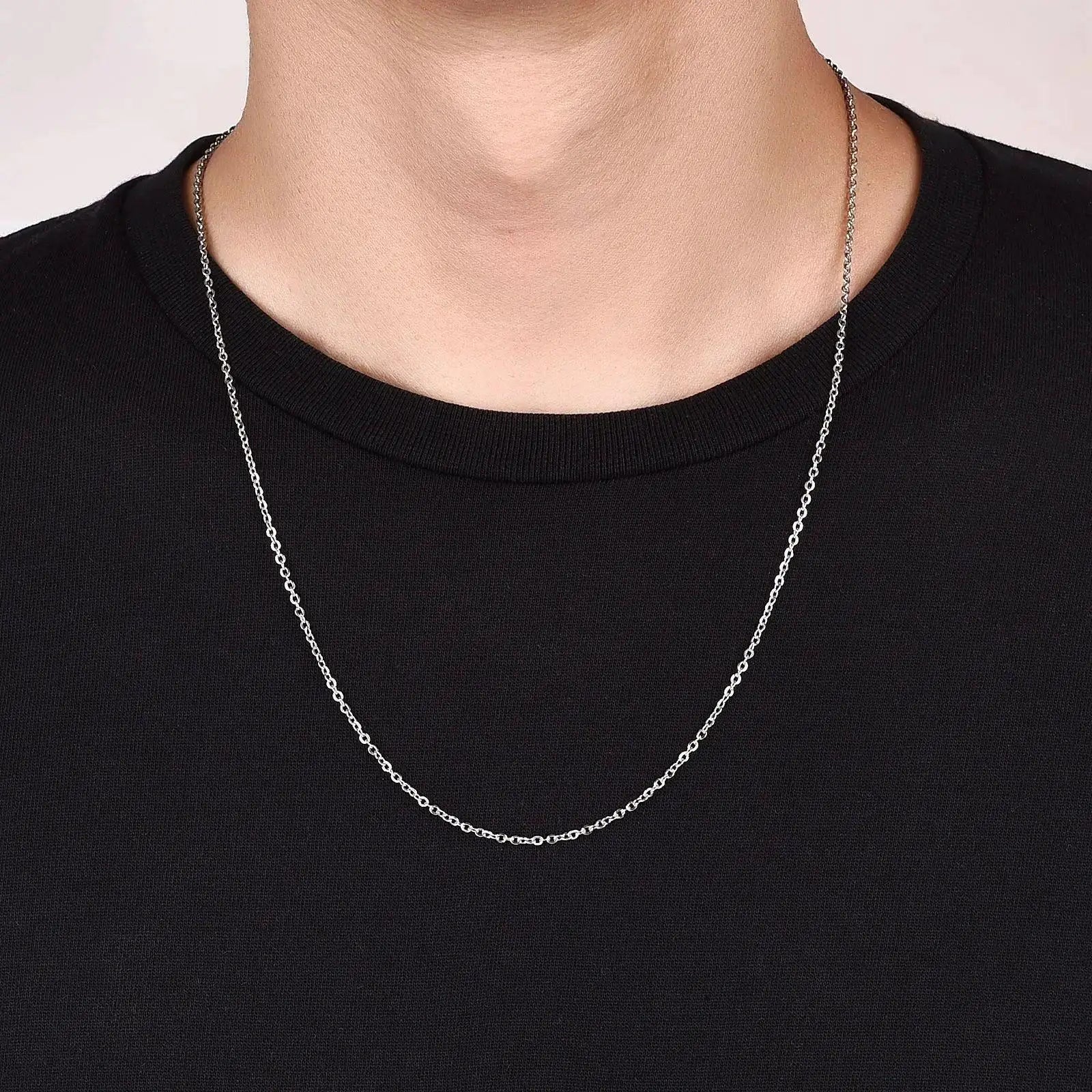 Gold color stainless steel chain necklace on model in black shirt, OurLum.com jewelry