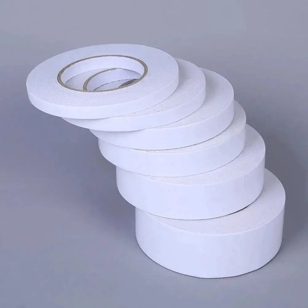 Stack of double-sided adhesive tape rolls for arts, crafts, scrapbooking at OurLum.com