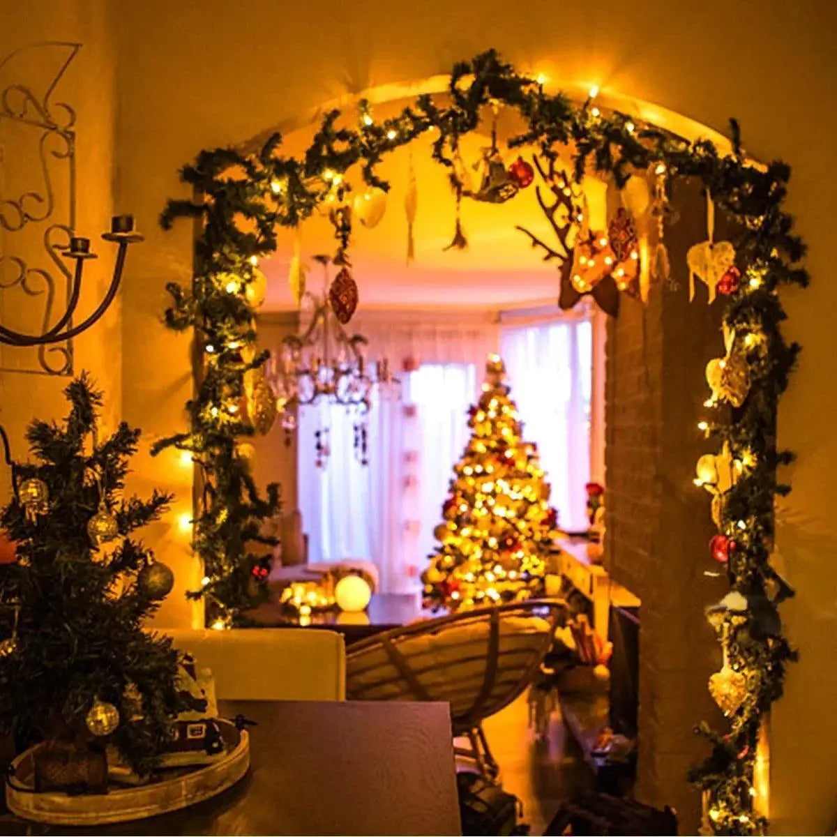 Warm LED fairy lights and garland decorate a cozy living room for Christmas at OurLum.com