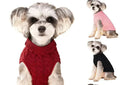Four dogs wearing colorful sweaters on a white background